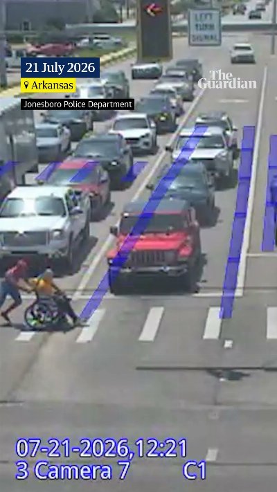 Driver dressed as Spider-Man helps man in wheelchair cross road