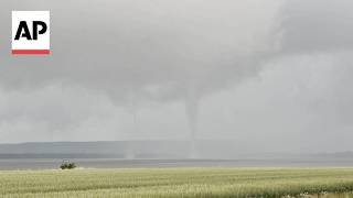 Rare double tornado whirls over water in western Sweden