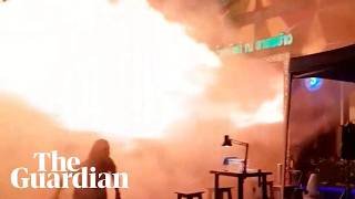 People flee as flames erupt from Bangkok pub fire