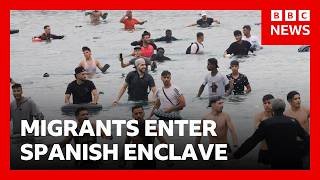 Thousands of migrants try to enter Spanish enclave of Ceuta from Morocco | BBC News