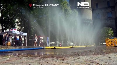 Germany heatwave sees Cologne residents cool off in mist