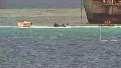 Naval crews beat each other with oars as Philippine and Chinese vessels clash over disputed territory