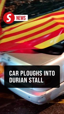 Car crashes into a durian stall after entering the wrong lane in Kepong