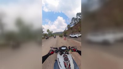 Biker Crashes Into Moving Car After Losing Balance